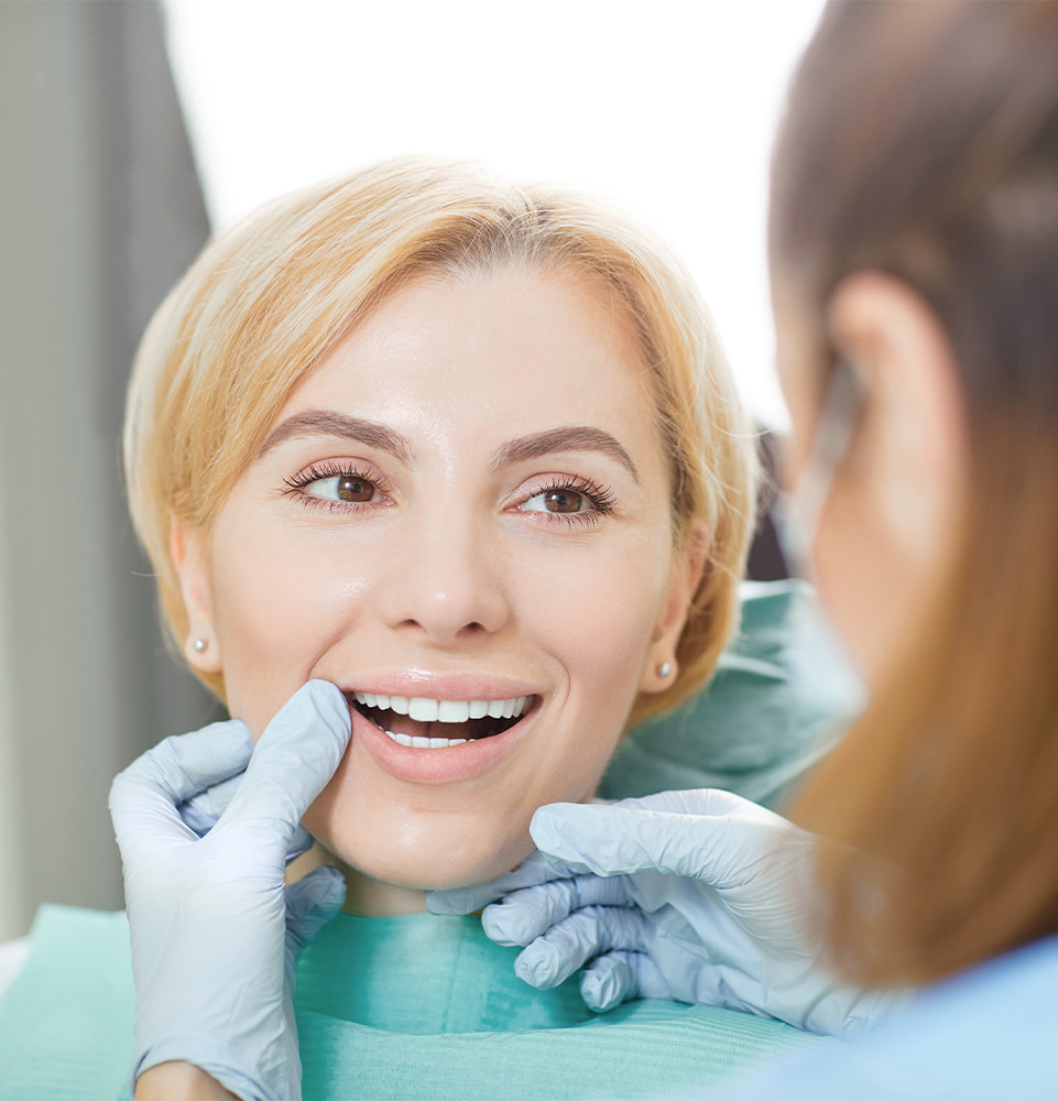Dr. checking patient smile